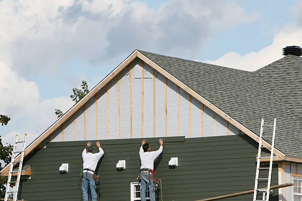 Professional Siding technician working in Pelham, NC
